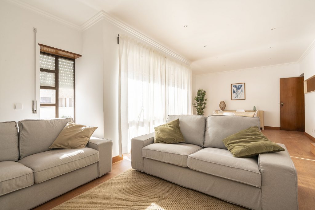 Ericeira Paradise Guest House Living Room area with sunny windows, coworking spaces and comfortable sofas